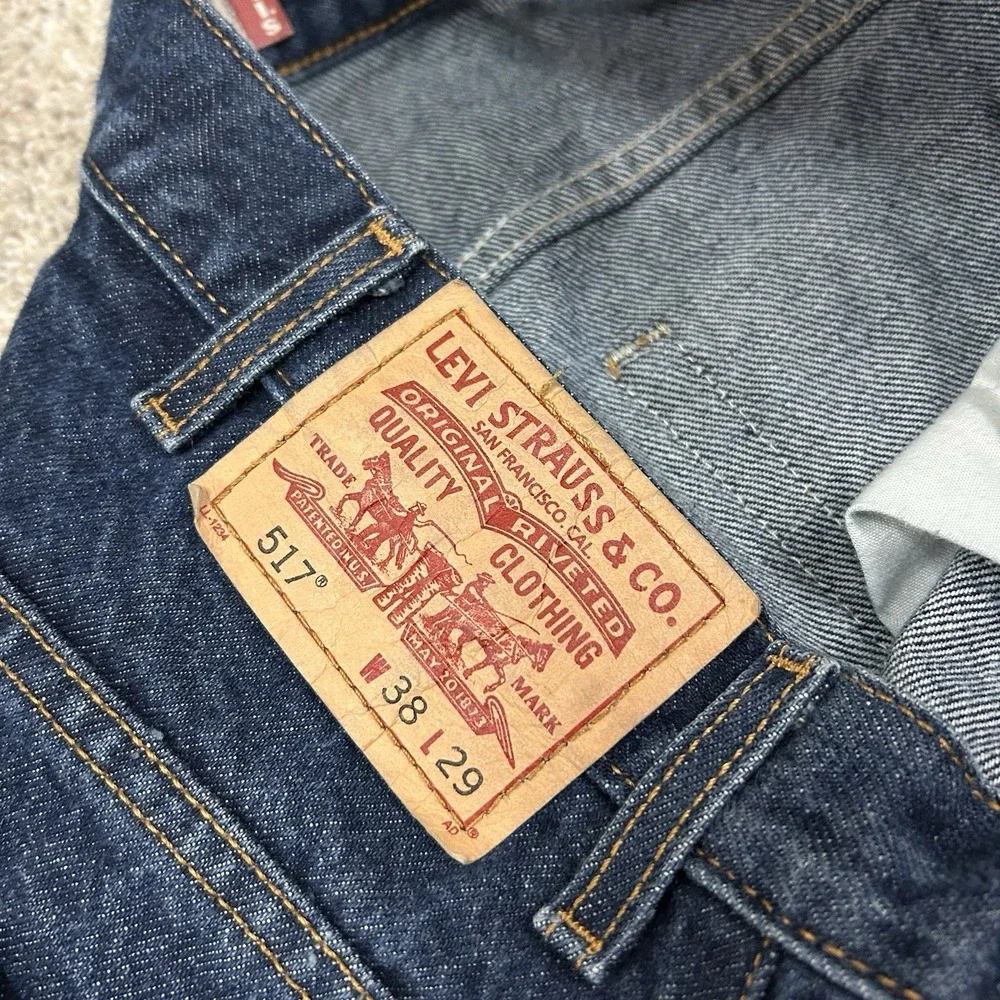 Vintage Levi's 517 Bootcut Jeans 38x27 Blue Indigo Denim Distressed Hems Mens